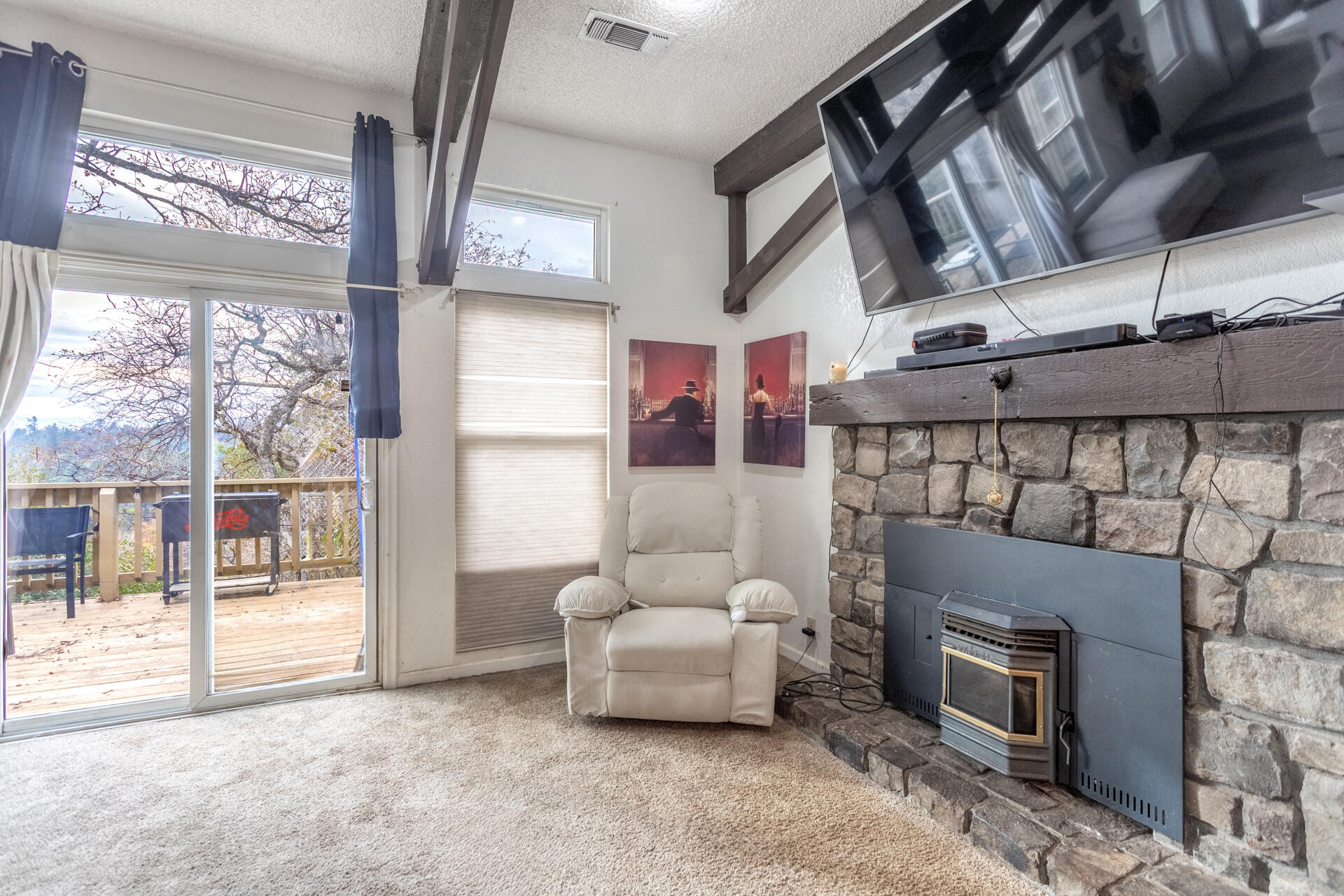4720 Enchanted Way Redding, CA 96001 - Photo 4 of 19 a living room with furniture and a fireplace