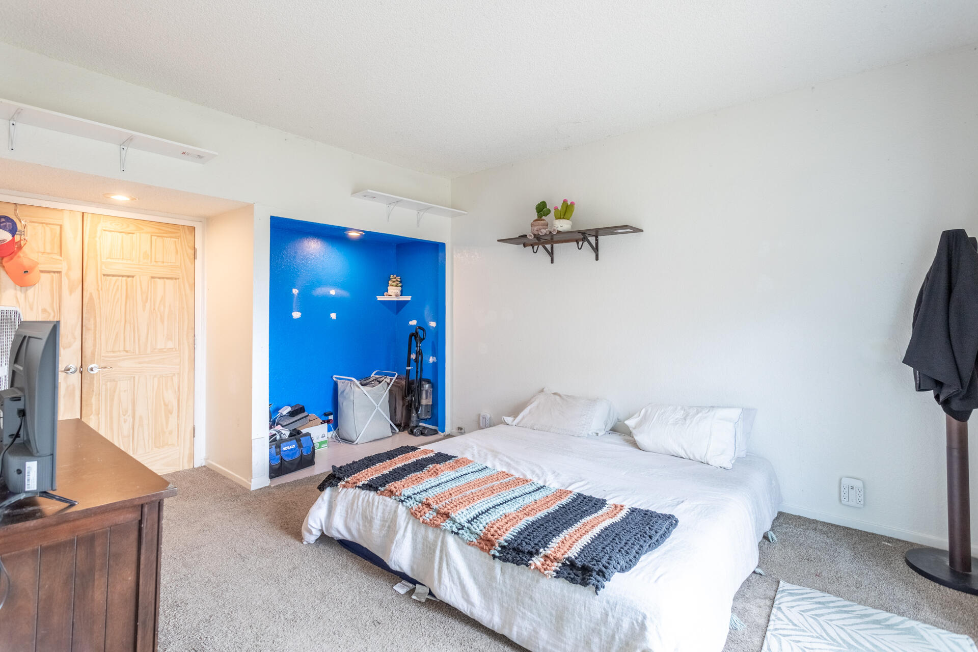 4720 Enchanted Way Redding, CA 96001 - Photo 10 of 19 a bedroom with a bed and a flat screen tv