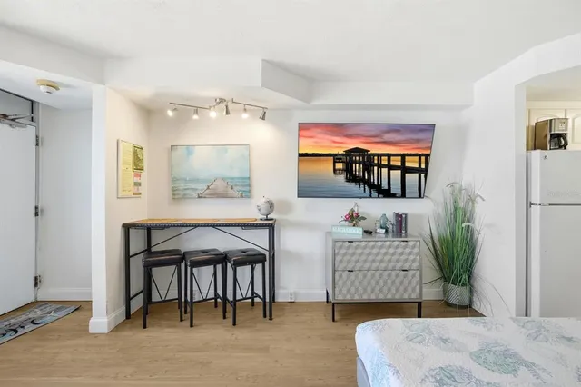 a bedroom with a bed and a dresser