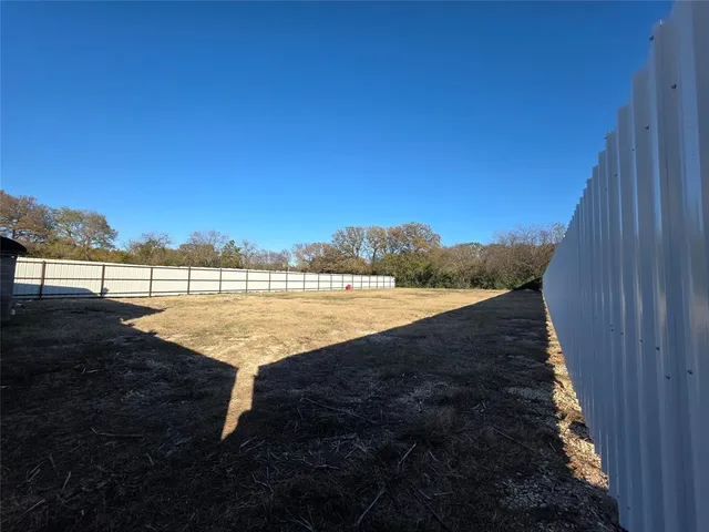 a view of a swimming pool with an outdoor space and seating area