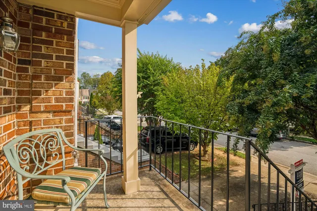 a living room with furniture a couch and a window