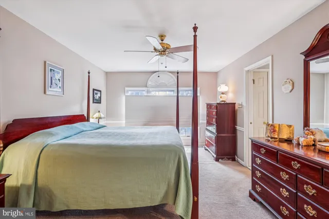 a bathroom with a sink toilet and shower curtain