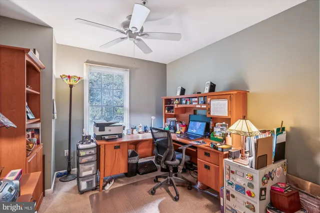 a picture of a bench in front of a wall