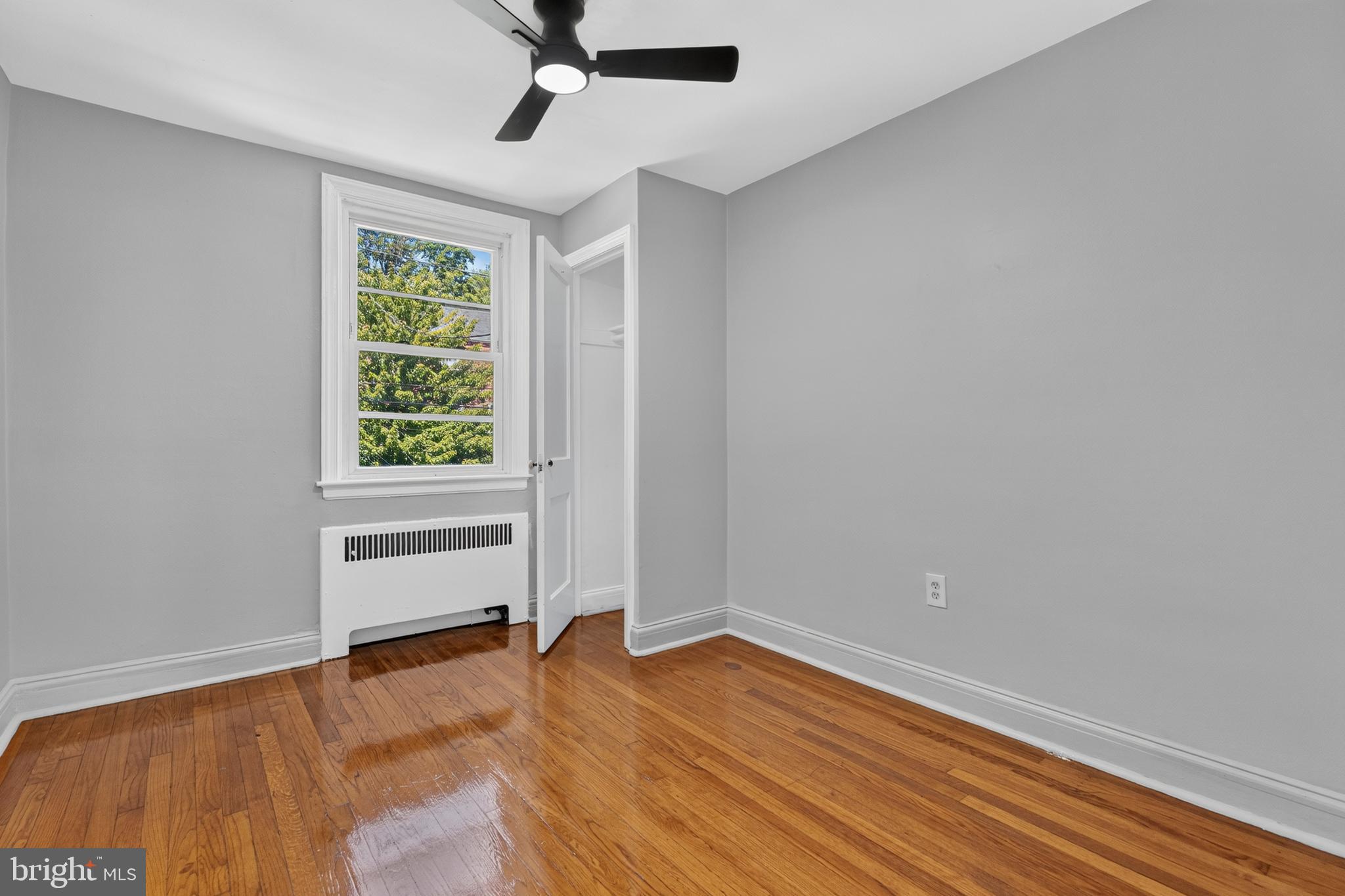 3906 Yolando Road Baltimore, MD 21218 - Photo 15 of 30 an empty room with a window and wooden floor