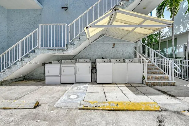 a view of a backyard with swimming pool