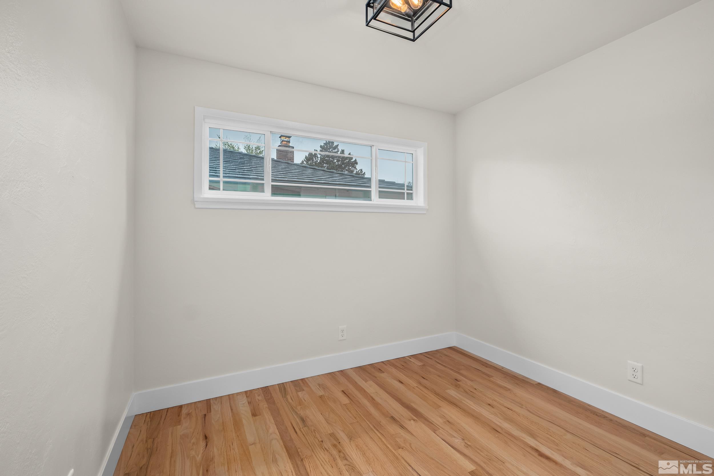 1220 Vassar Street Reno, NV 89502 - Photo 19 of 36 wooden floor in an empty room