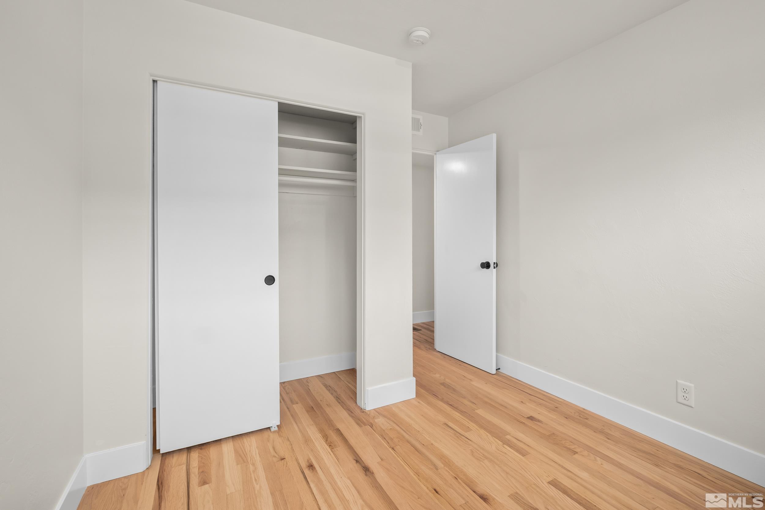 1220 Vassar Street Reno, NV 89502 - Photo 21 of 36 wooden floor in an empty room