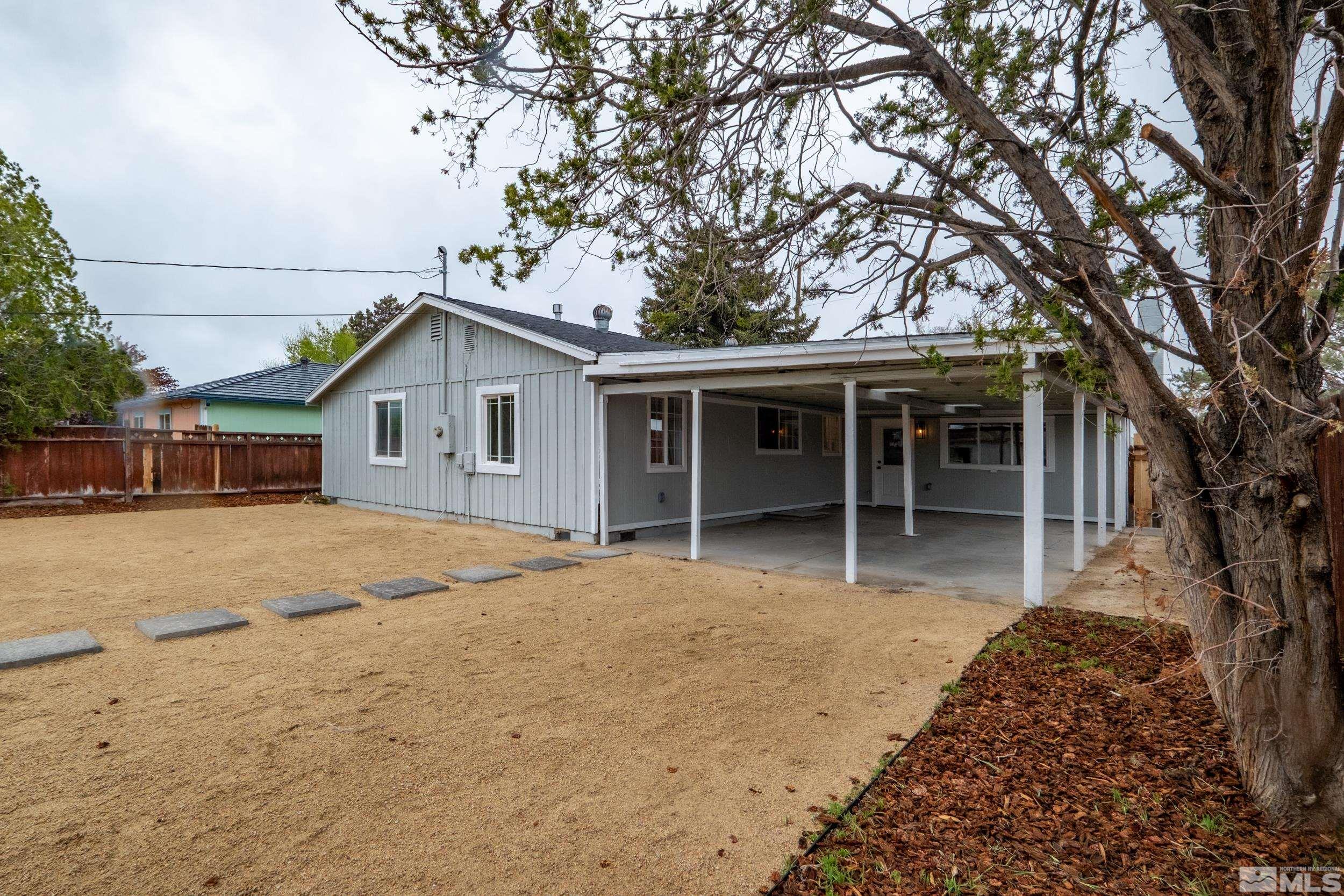 1220 Vassar Street Reno, NV 89502 - Photo 24 of 36 a house with trees in front of it