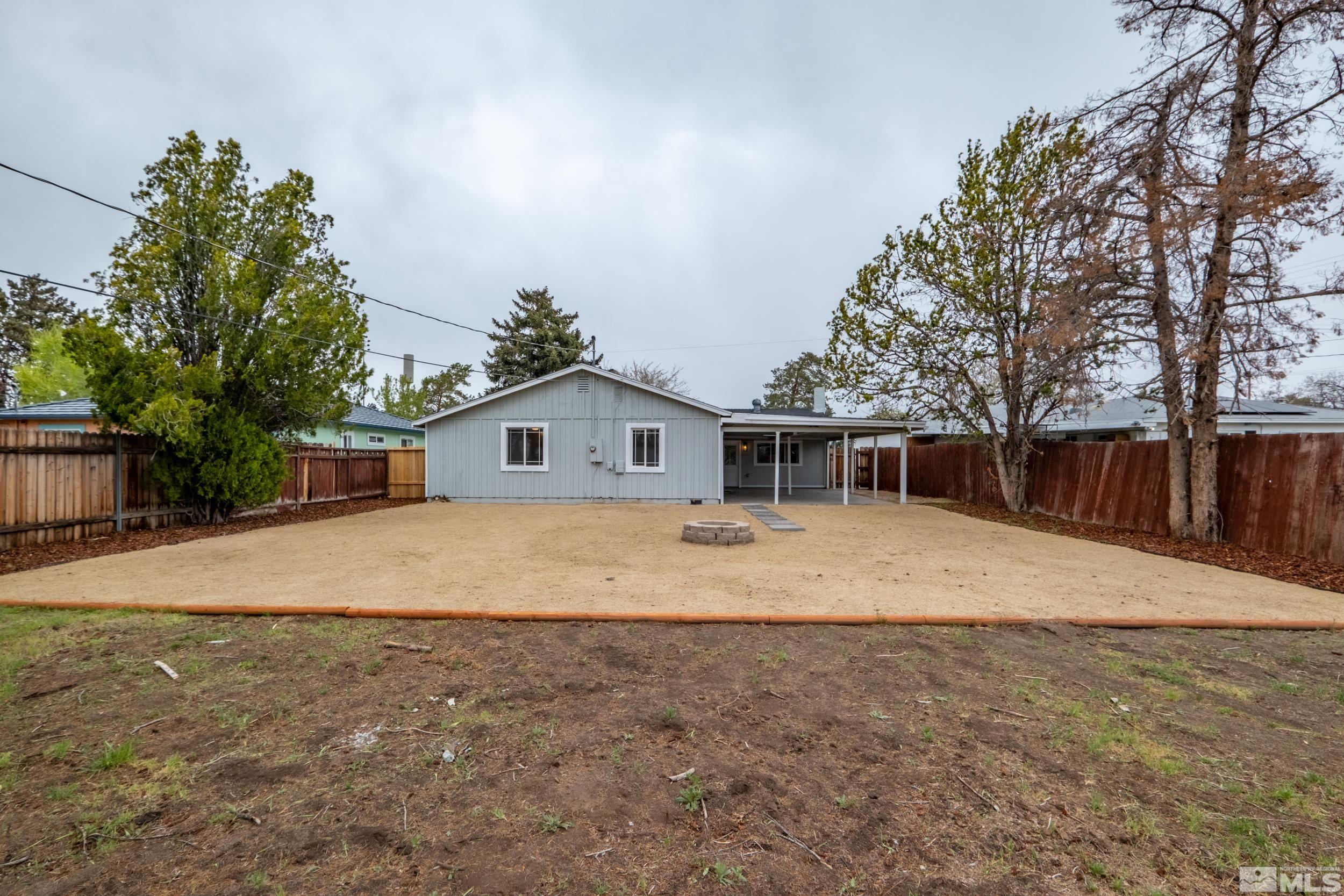 1220 Vassar Street Reno, NV 89502 - Photo 25 of 36 a front view of a house with a yard