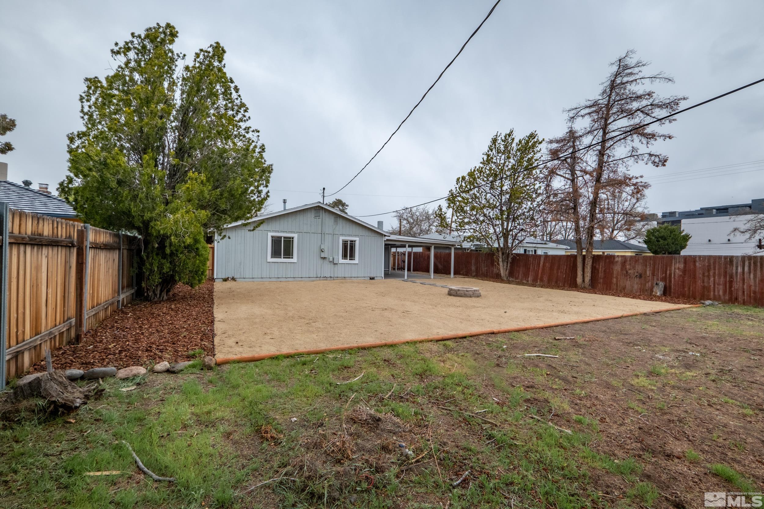 1220 Vassar Street Reno, NV 89502 - Photo 28 of 36 a front view of a house with a yard and trees