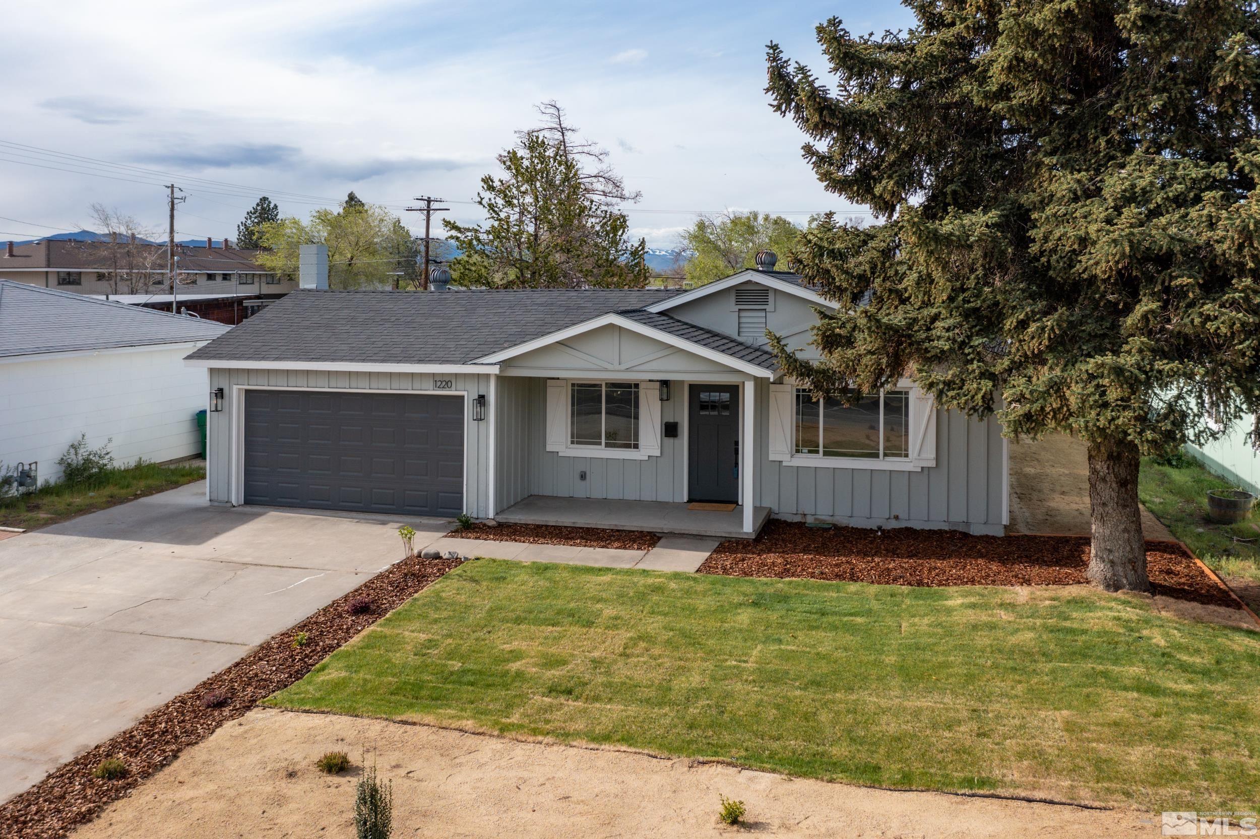 1220 Vassar Street Reno, NV 89502 - Photo 29 of 36 a view of a yard in front of a house with large tree