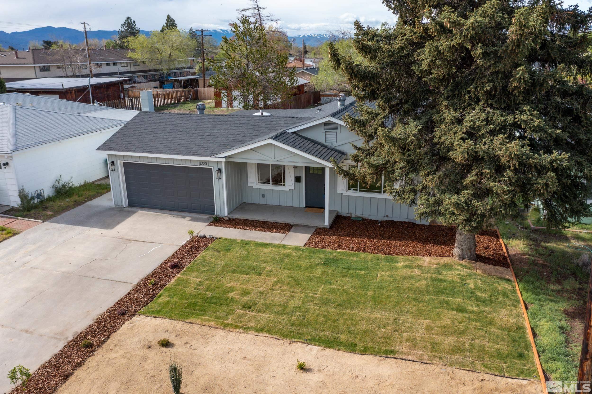 1220 Vassar Street Reno, NV 89502 - Photo 30 of 36 a view of a house with a yard balcony and tree