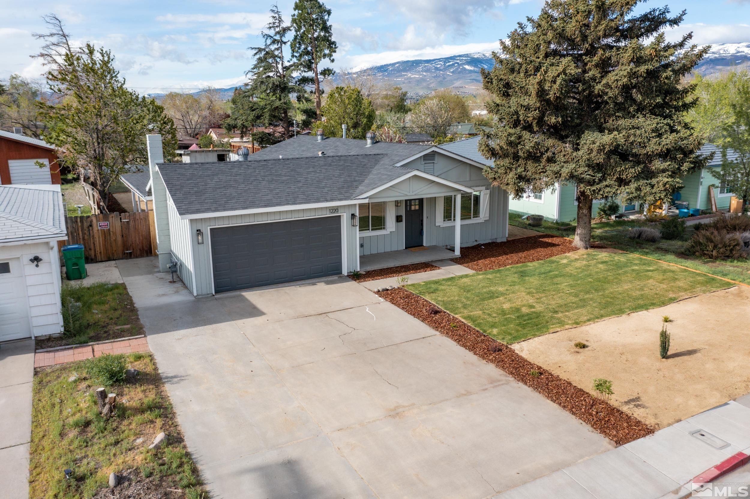 1220 Vassar Street Reno, NV 89502 - Photo 31 of 36 front view of a house with a yard