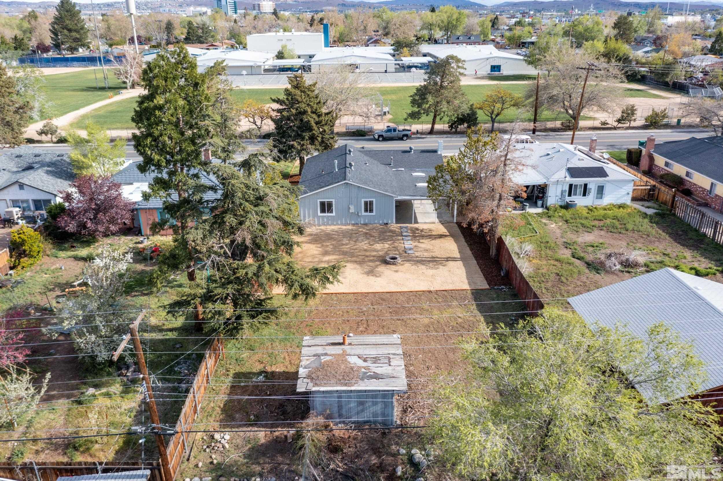 1220 Vassar Street Reno, NV 89502 - Photo 34 of 36 an aerial view of residential houses with outdoor space and swimming pool