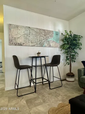 a view of a livingroom with furniture and a potted plant