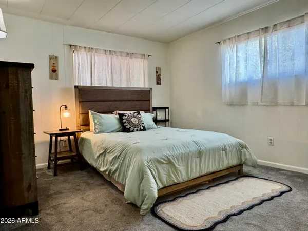 a bedroom with a bed and window
