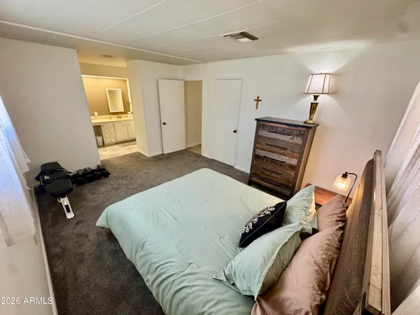 a bed room with a bed and a window