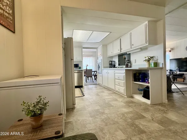 a view of a kitchen with furniture and a kitchen