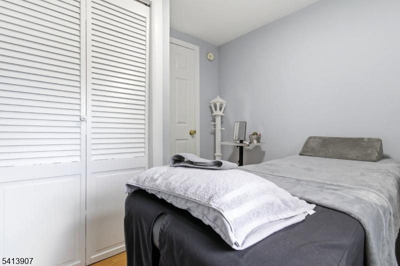 32 Cedar Avenue Elizabeth, NJ 07202 - Photo 11 of 32 a bedroom with a bed and a window