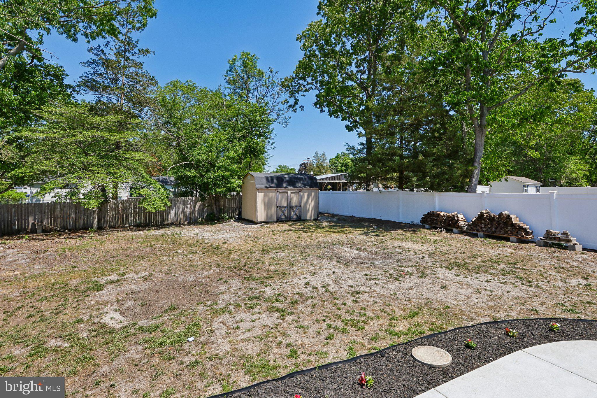 73 Burnt Tavern Road Brick, NJ 08724 - Photo 26 of 31 a view of a yard with large tree