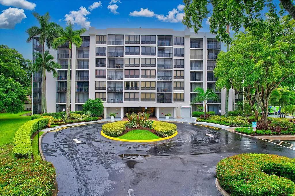 a front view of a house with a yard fire pit and outdoor seating
