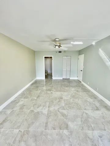 a bathroom with a double vanity sink toilet and a mirror
