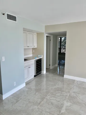 a view of kitchen with furniture and window