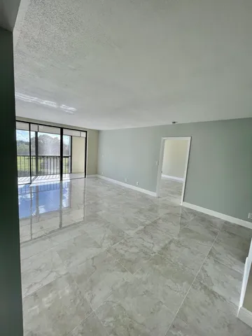 an empty room with glass door