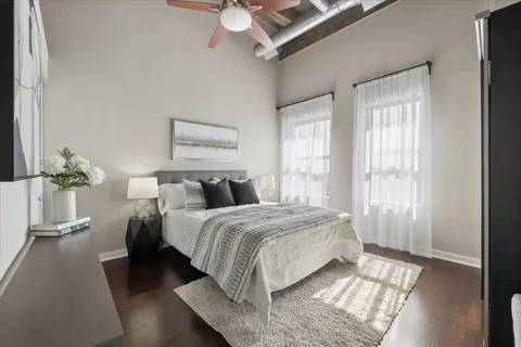 a bedroom with bed and a window