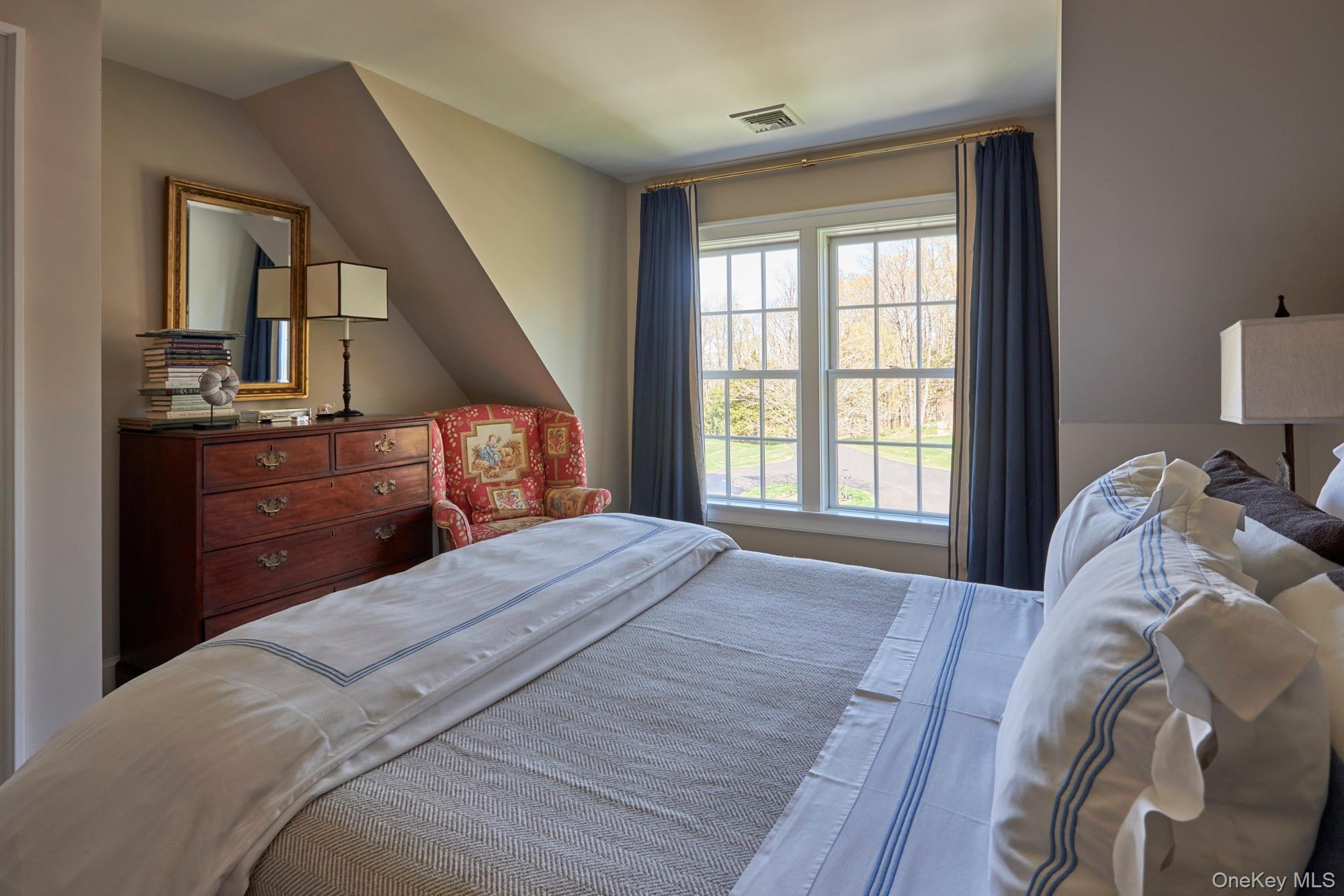 790 Stanford Road Millbrook, NY 12545 - Photo 35 of 50 a bedroom with a bed and wooden floor