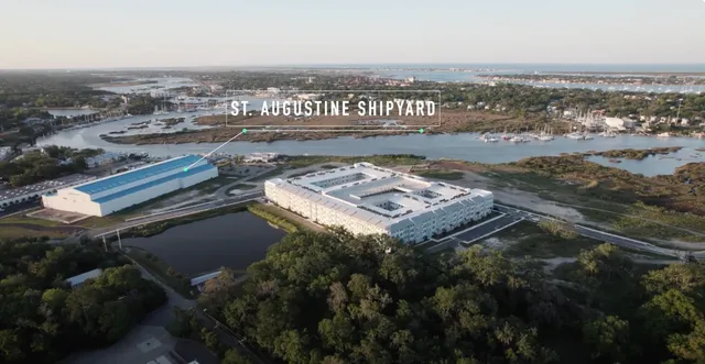 an aerial view of residential building with ocean view