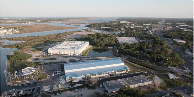 an aerial view of residential houses with outdoor space