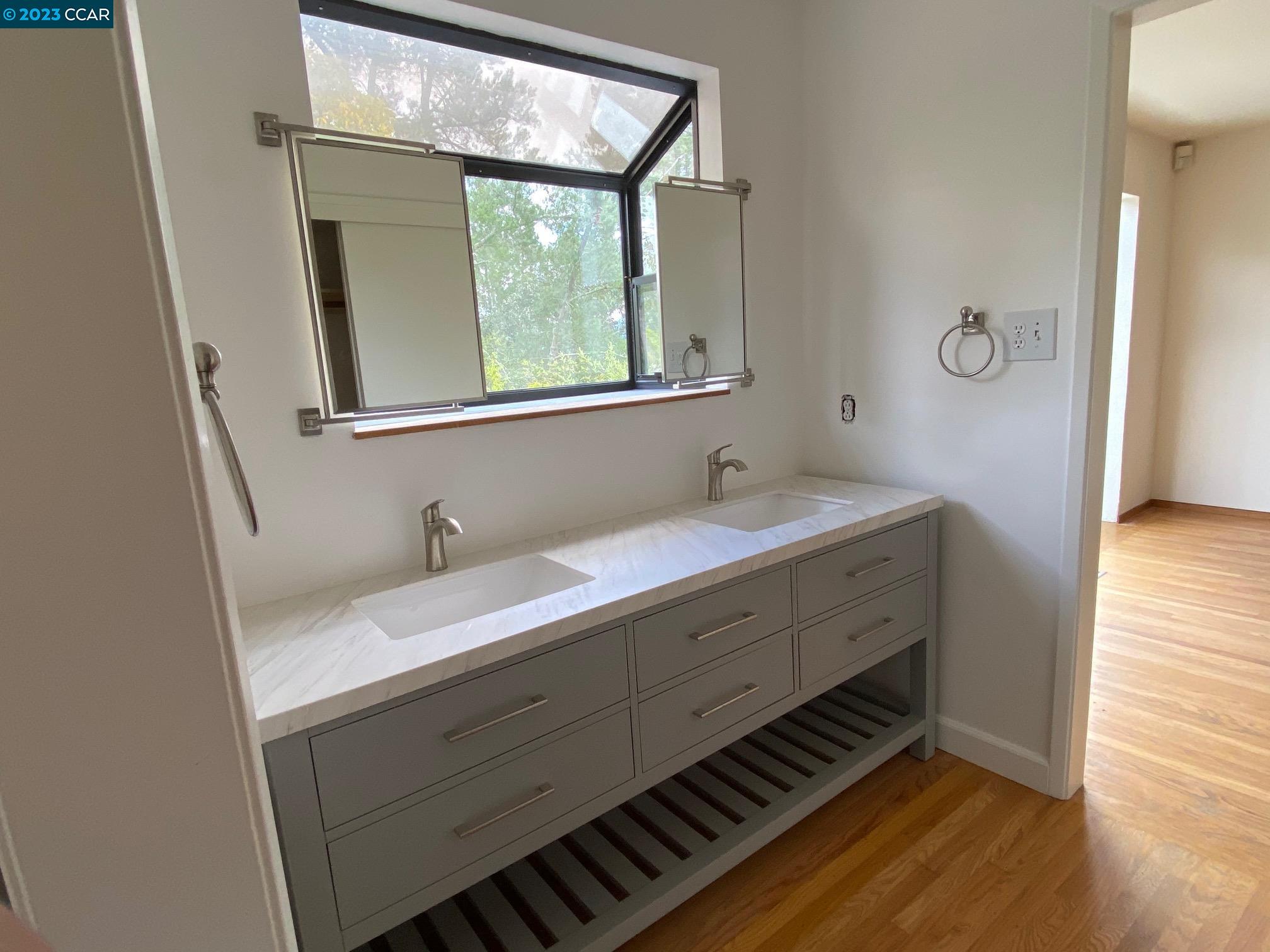 45 Sullivan Drive Moraga, CA 94556 - Photo 11 of 12 a bathroom with a sink and a mirror