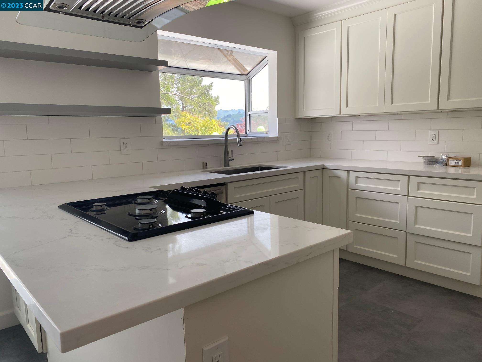 45 Sullivan Drive Moraga, CA 94556 - Photo 6 of 12 a white stove top oven sitting inside of a kitchen