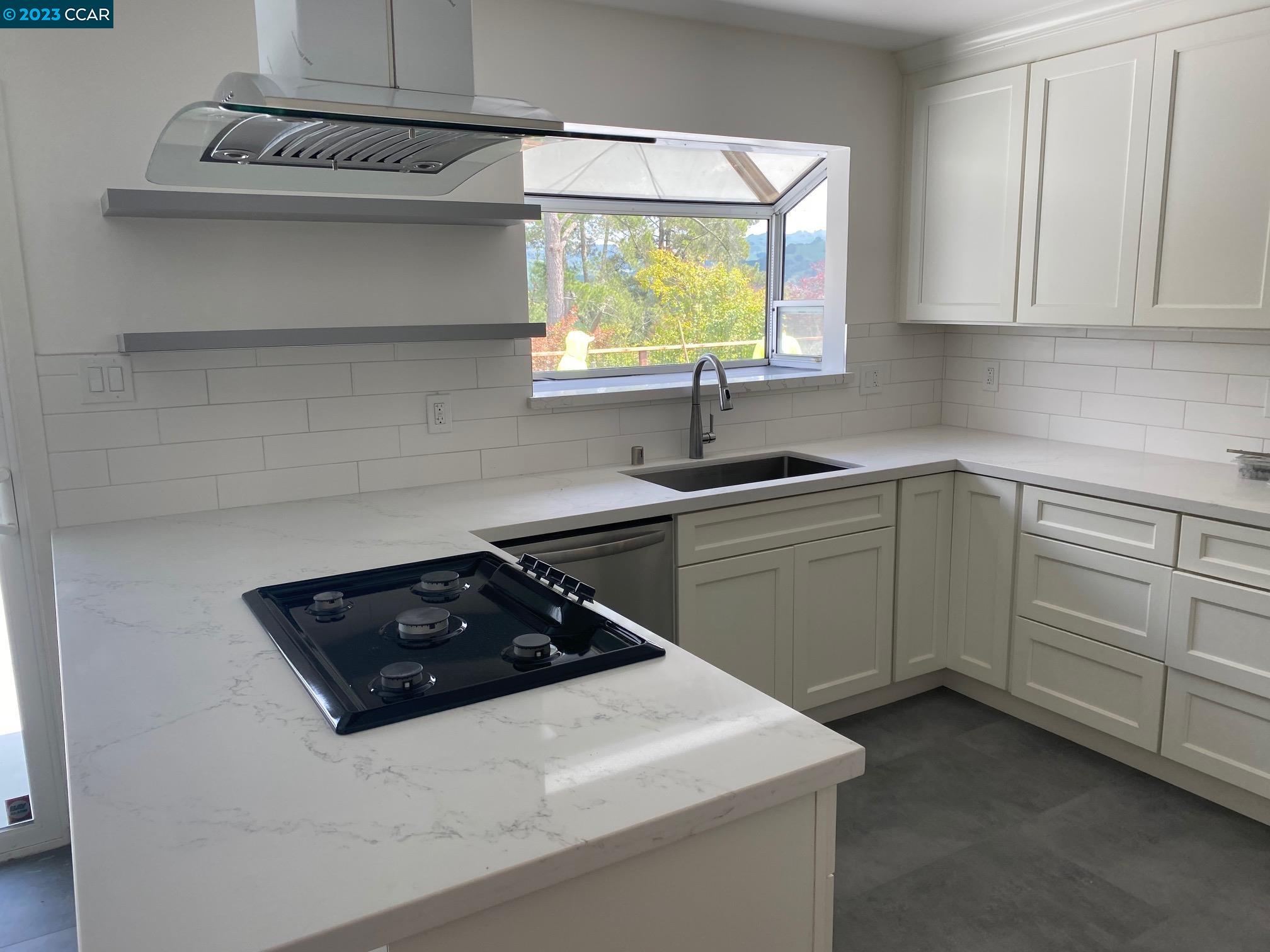 45 Sullivan Drive Moraga, CA 94556 - Photo 7 of 12 a kitchen with a sink and cabinets