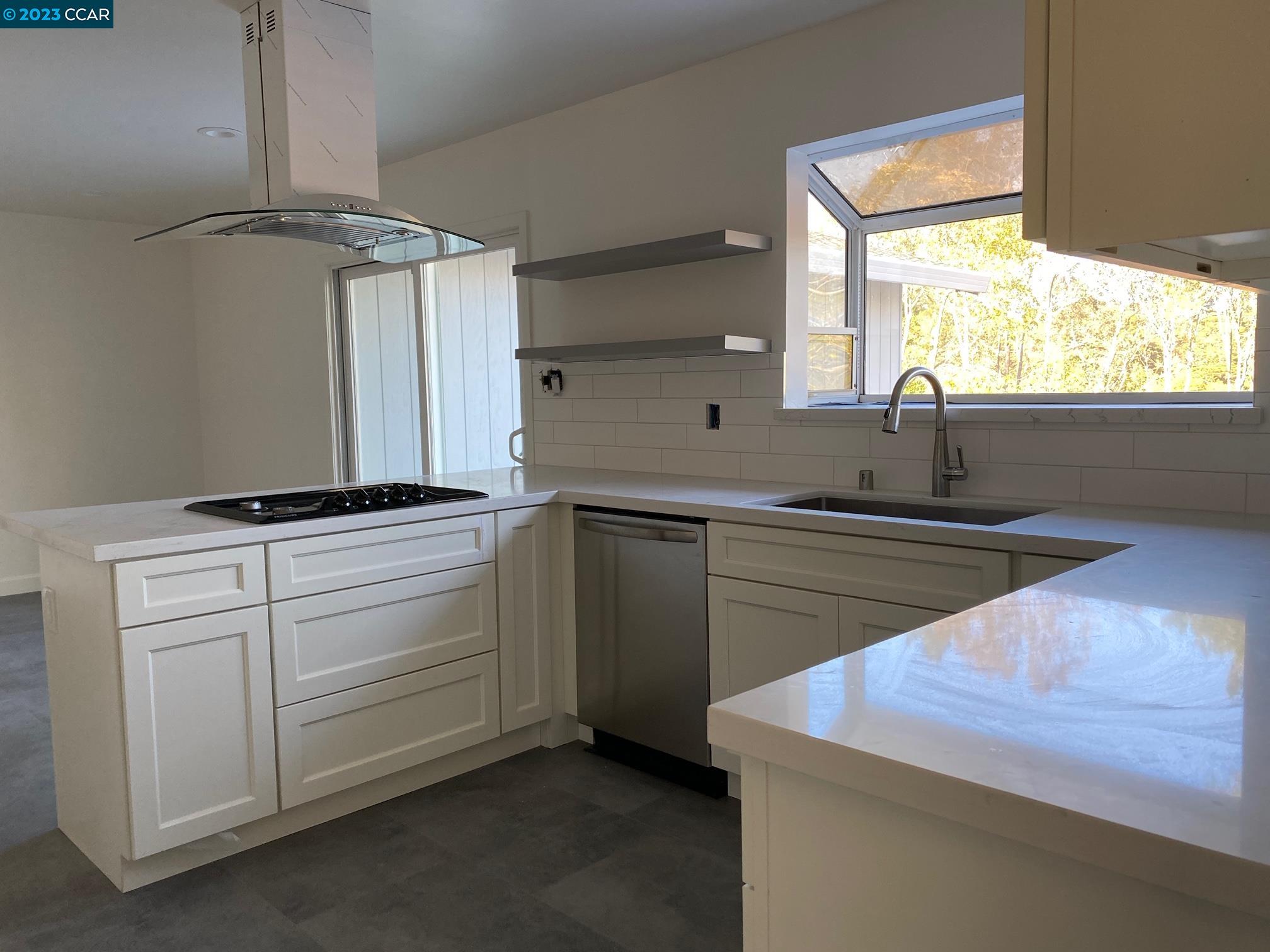 45 Sullivan Drive Moraga, CA 94556 - Photo 9 of 12 a kitchen with a sink and a window