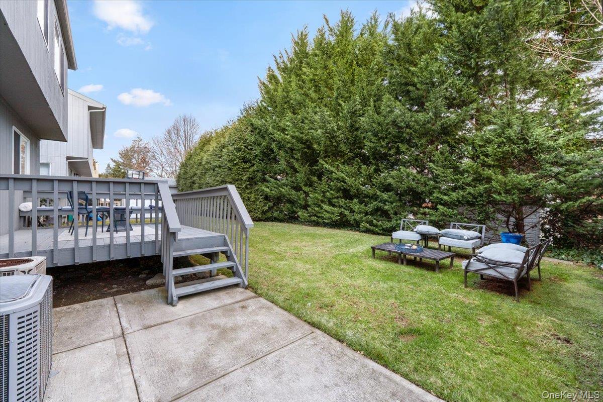 47 Berkshire Road Great Neck, NY 11023 - Photo 33 of 40 View of green lawn with a deck and outdoor lounge area