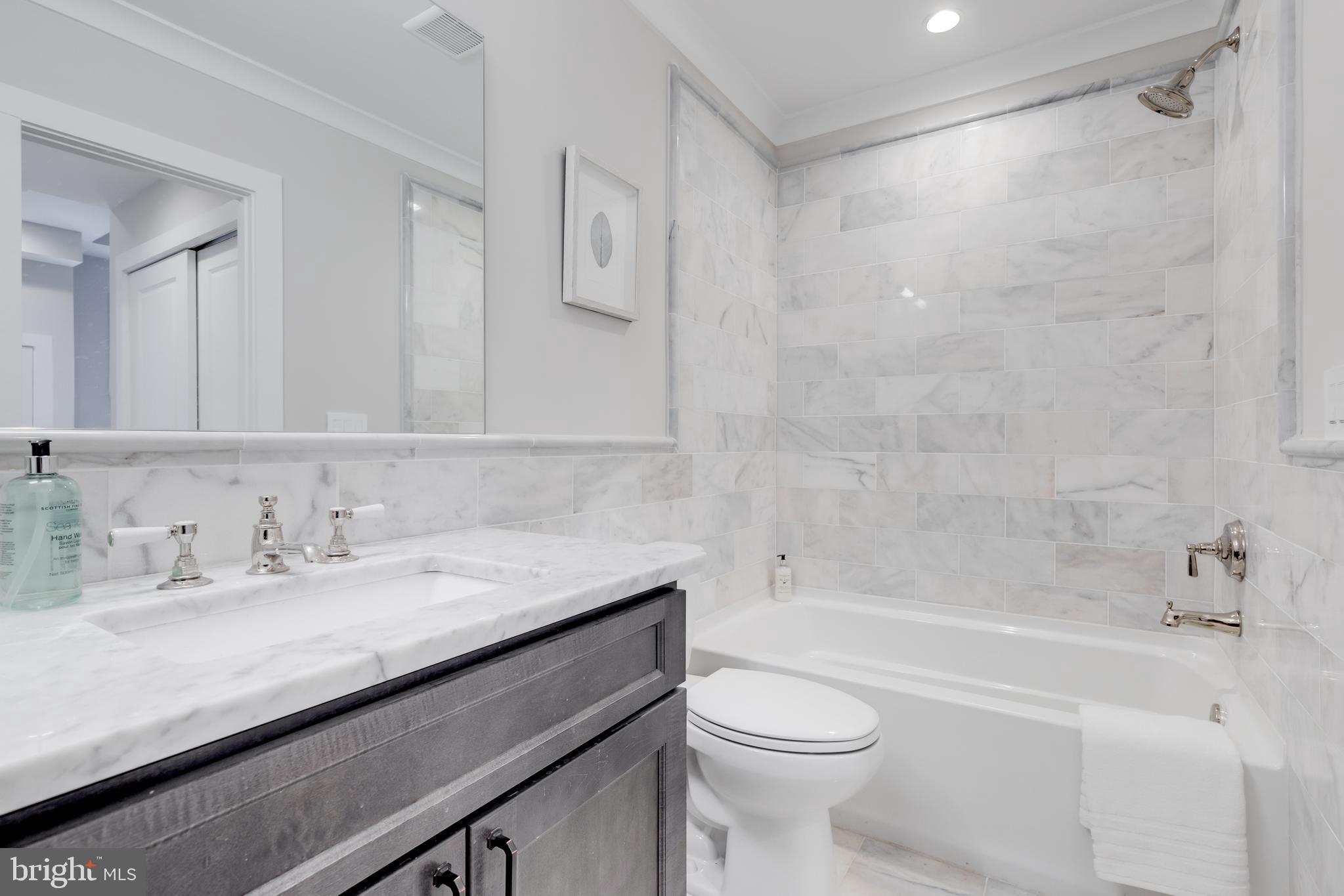 1314 Vermont Avenue Northwest, Unit CH6 Washington, DC 20005 - Photo 15 of 23 a bathroom with a sink a toilet and a bathtub