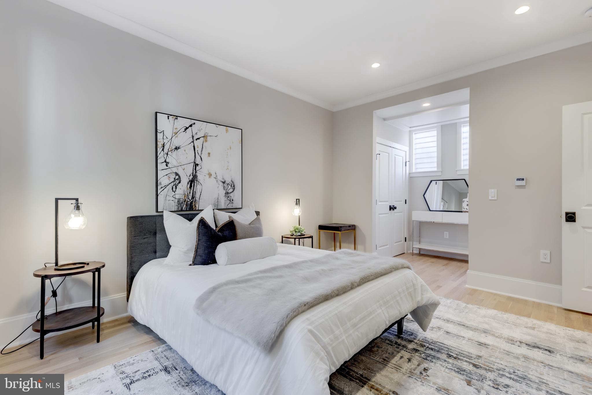 1314 Vermont Avenue Northwest, Unit CH6 Washington, DC 20005 - Photo 19 of 23 a bedroom with a bed and a lamp