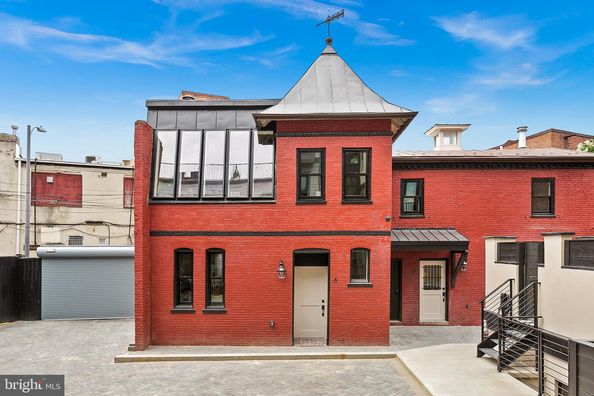 1314 Vermont Avenue Northwest, Unit CH6 Washington, DC 20005 - Photo 2 of 23 a front view of a house with a yard
