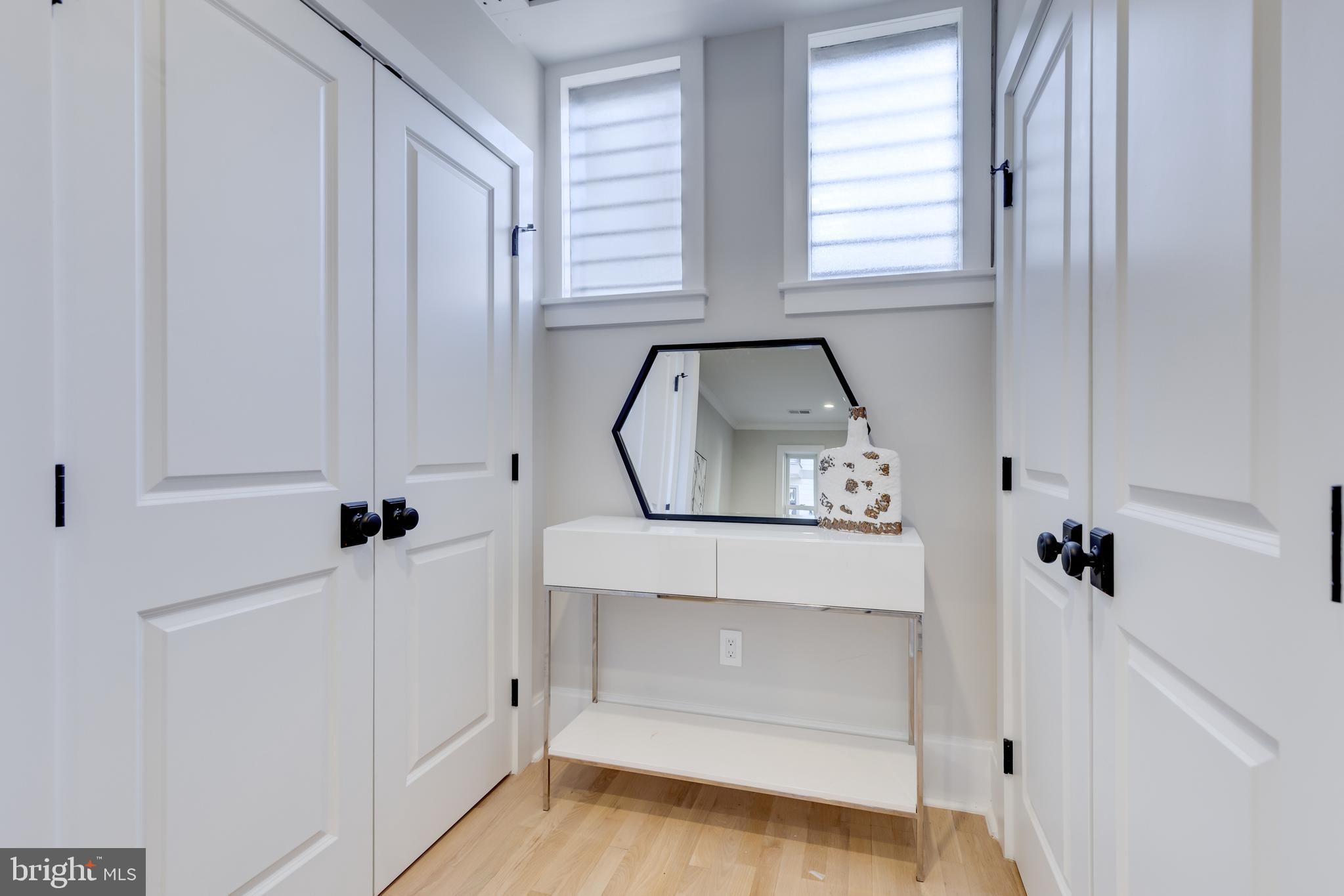 1314 Vermont Avenue Northwest, Unit CH6 Washington, DC 20005 - Photo 21 of 23 a view of staircase with white walls and a window