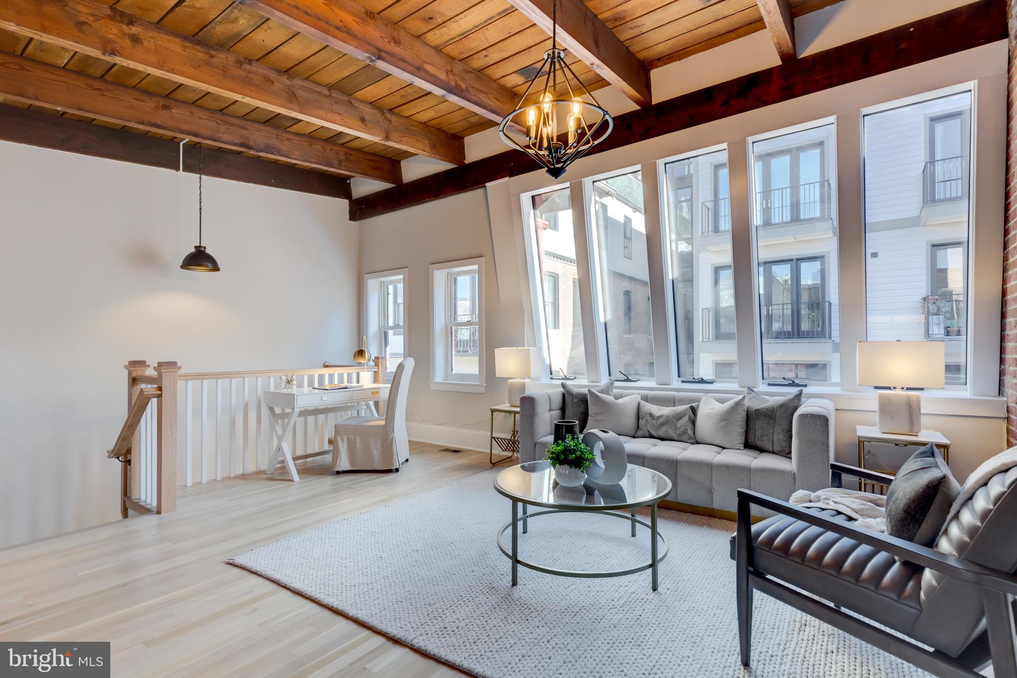 1314 Vermont Avenue Northwest, Unit CH6 Washington, DC 20005 - Photo 5 of 23 a living room with furniture and a large window