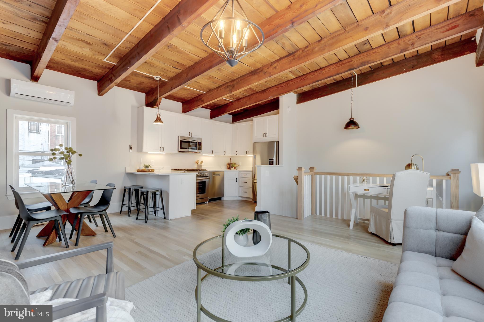 1314 Vermont Avenue Northwest, Unit CH6 Washington, DC 20005 - Photo 6 of 23 a living room with furniture and kitchen view