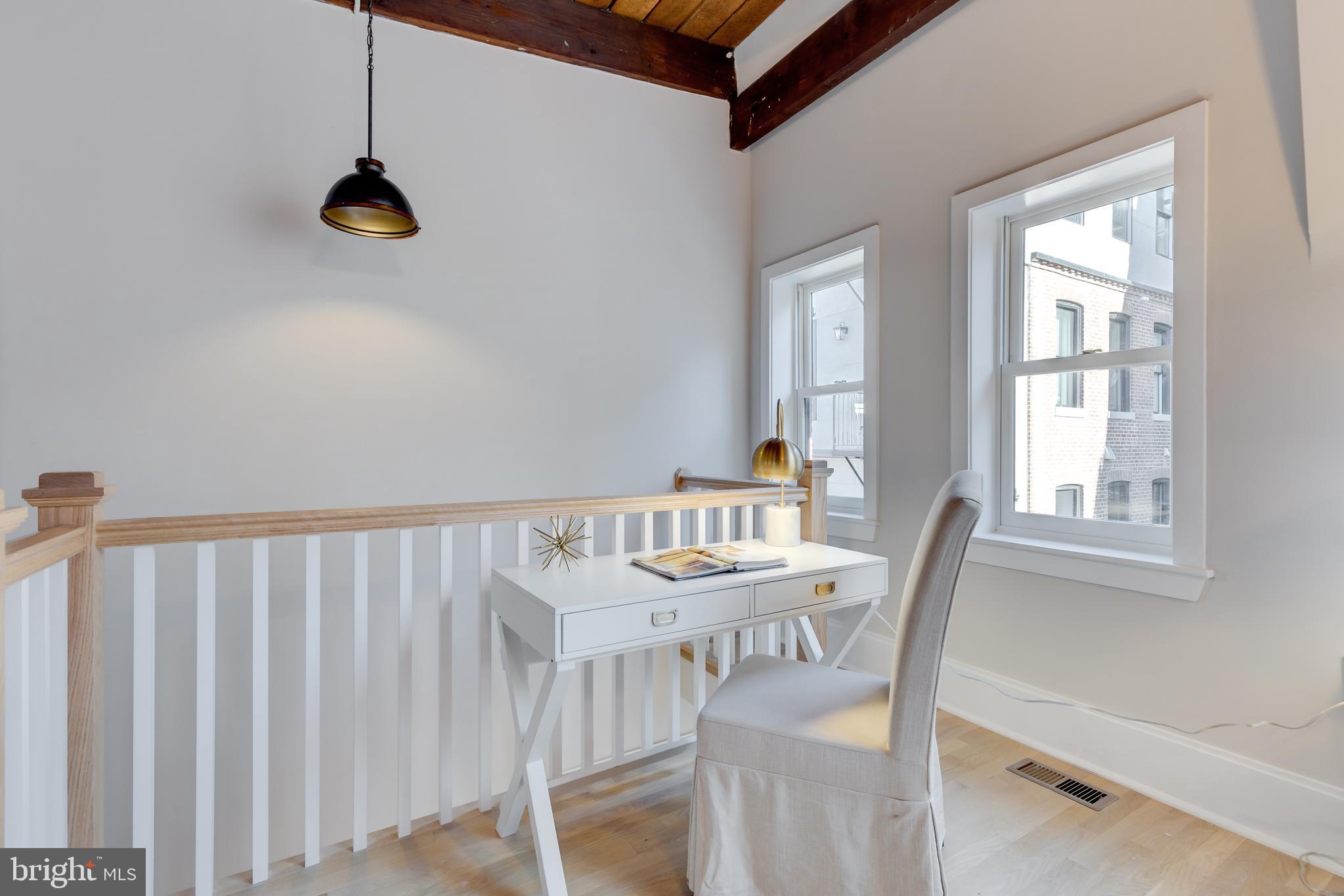 1314 Vermont Avenue Northwest, Unit CH6 Washington, DC 20005 - Photo 8 of 23 a view of a dining room with furniture