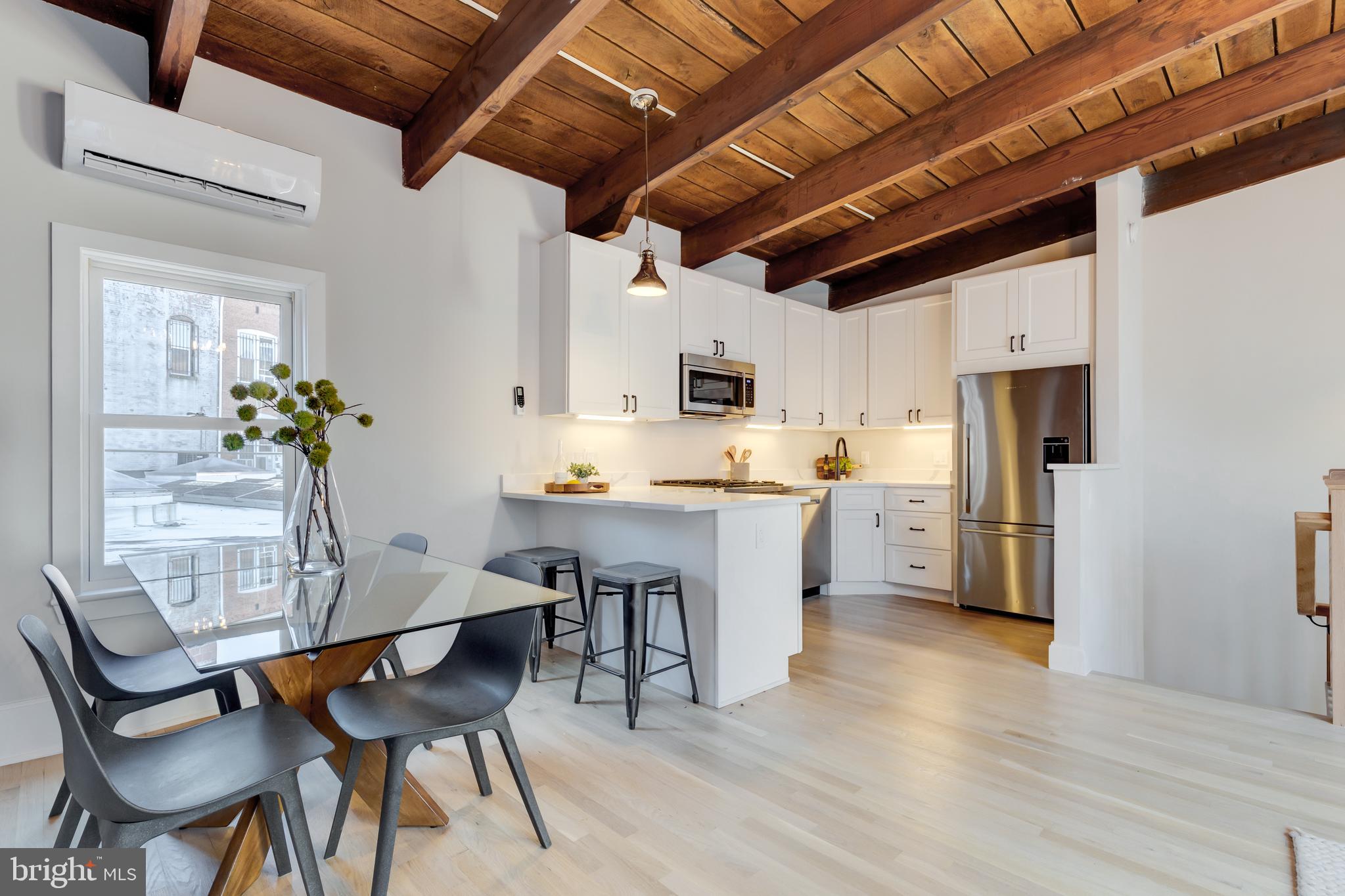 1314 Vermont Avenue Northwest, Unit CH6 Washington, DC 20005 - Photo 9 of 23 a view of a dining room with furniture and wooden floor