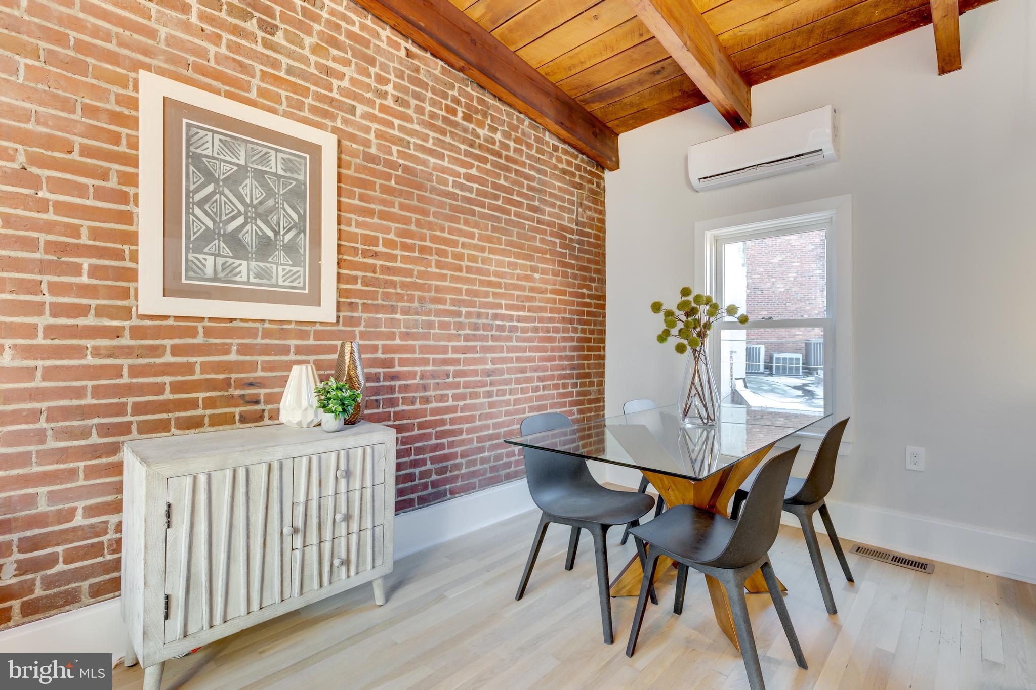 1314 Vermont Avenue Northwest, Unit CH6 Washington, DC 20005 - Photo 10 of 23 a view of a dining room with furniture and wooden floor