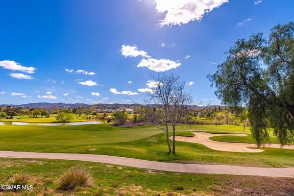 a view of a swimming pool with an ocean view