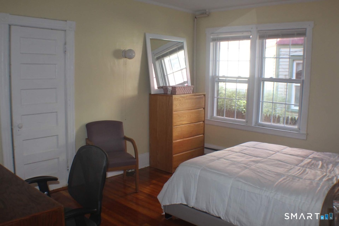 150 Whitney Street Hartford, CT 06105 - Photo 38 of 39 a bedroom with a bed and a window