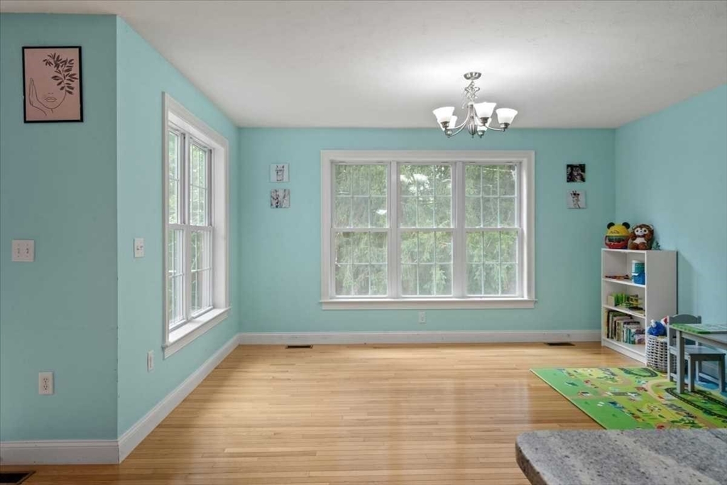 28 McIntosh Drive, Unit 22 Stow, MA 01775 - Photo 16 of 38 a view of an empty room with a window and bathroom