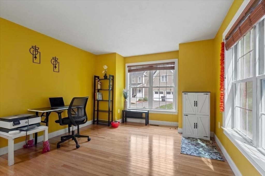 28 McIntosh Drive, Unit 22 Stow, MA 01775 - Photo 18 of 38 a view of a workspace with furniture and a window